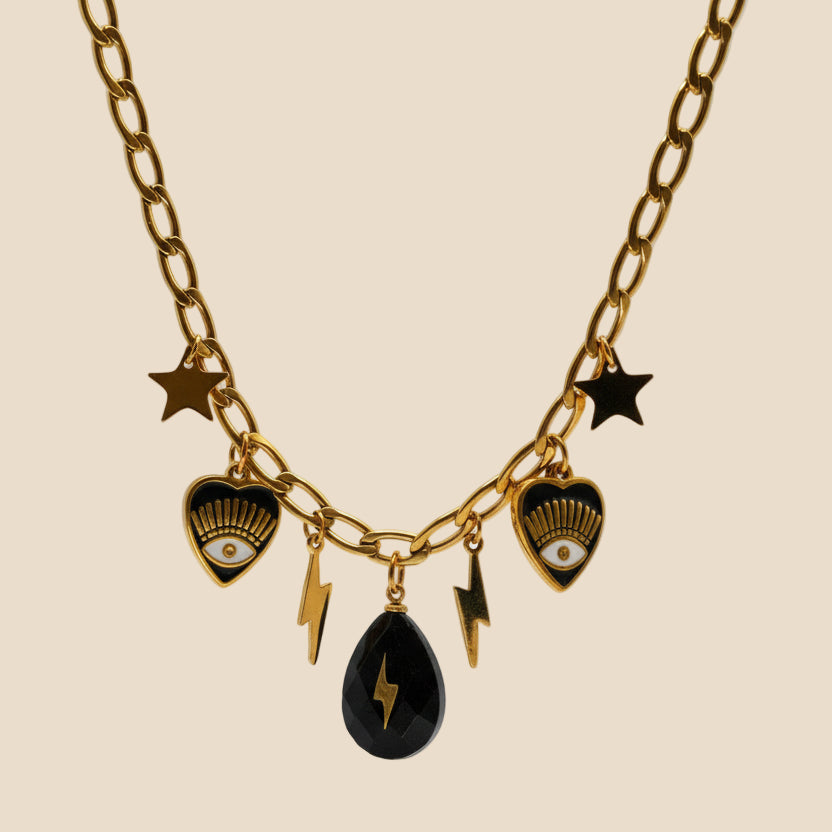 18K gold-plated curb chain with evil eye black details and stars and lightning bolt charms